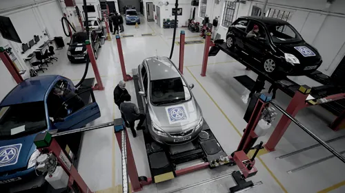 MOT Expert test bay with cars on ramps for Classes 4 and 7 testing